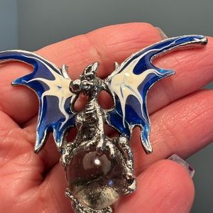 Dragon holding crystal ball necklace.